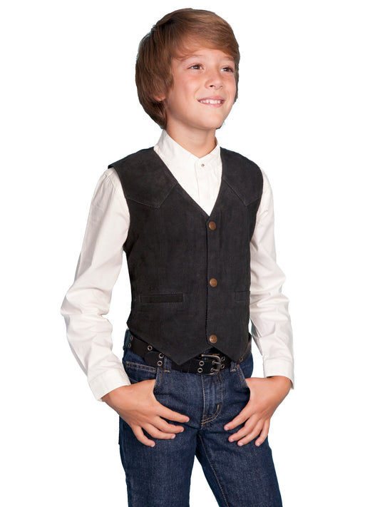 Boy standing in in black vest