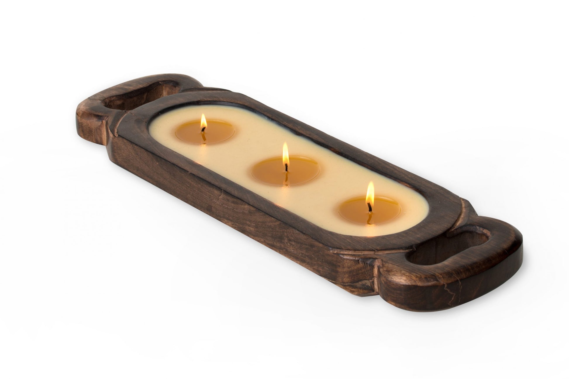 Wooden candle tray with three lit candles on a white background
