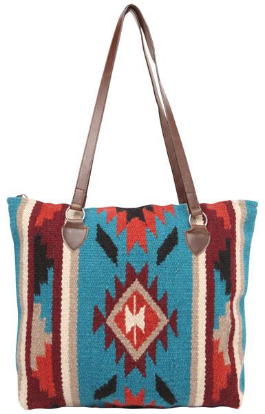 Colorful patterned bag with brown leather straps on a white background