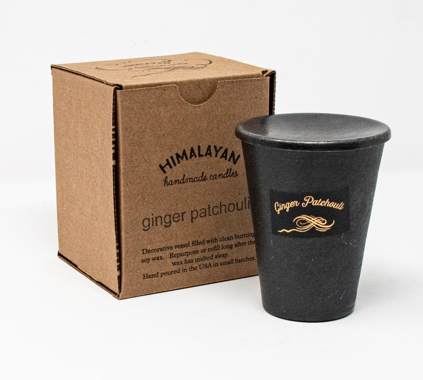 Black candle in a decorative container with 'Himalayan Handmade Candles' branding on a white background