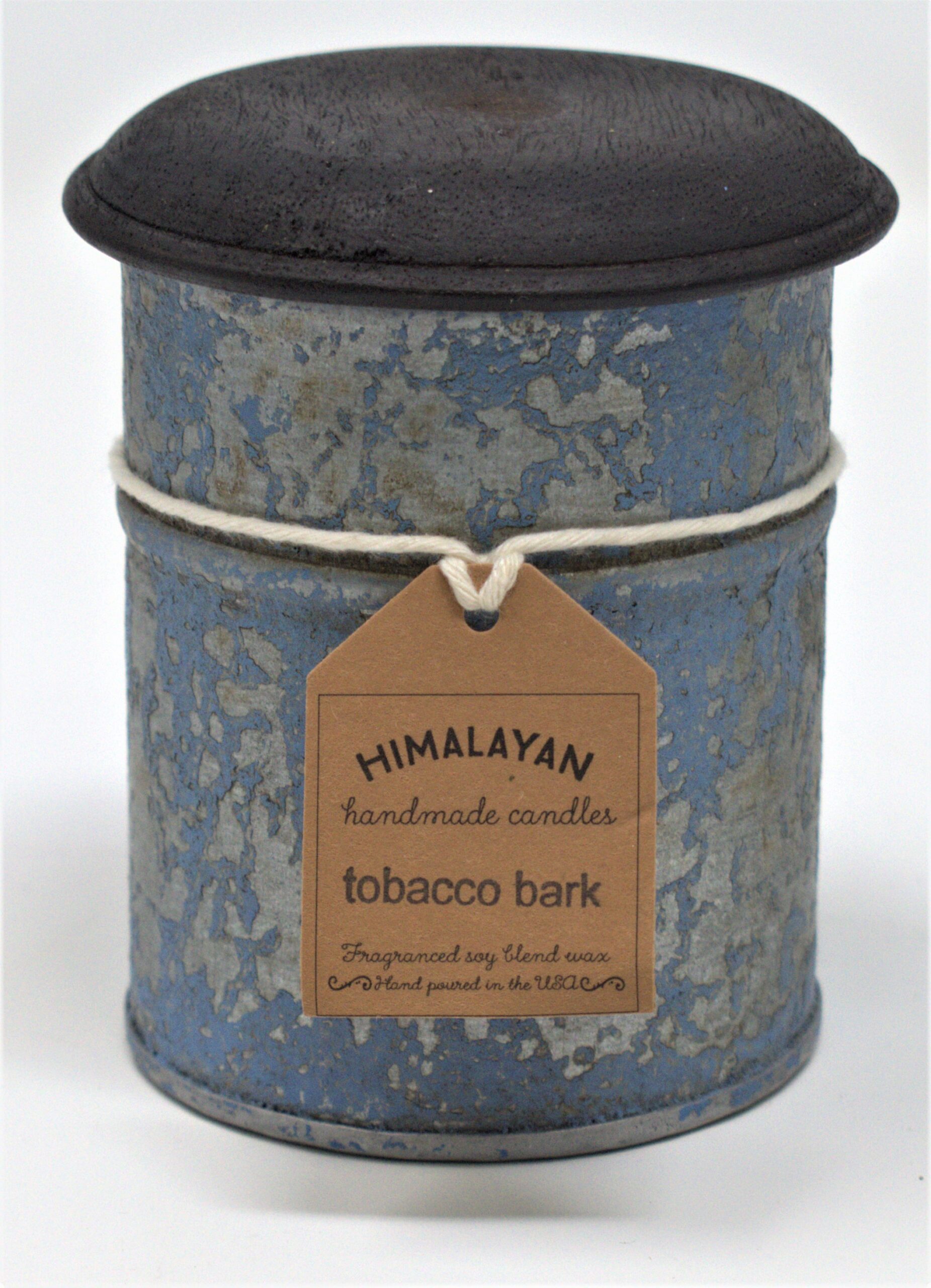 Cylindrical candle in a blue tin with a black lid, featuring a 'Himalayan Handmade Candles' label.