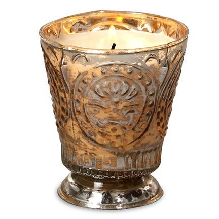 Decorative candle holder with intricate design on a white background